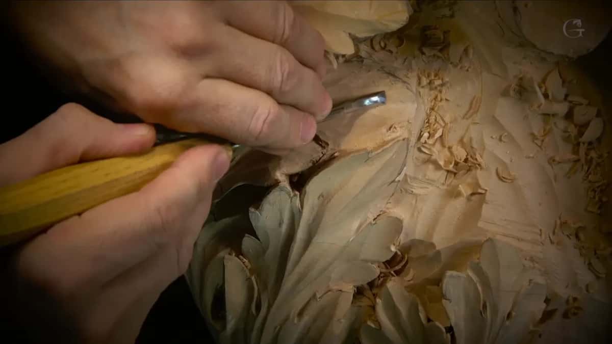 Yellow handle, short curved edge, curls of shavings