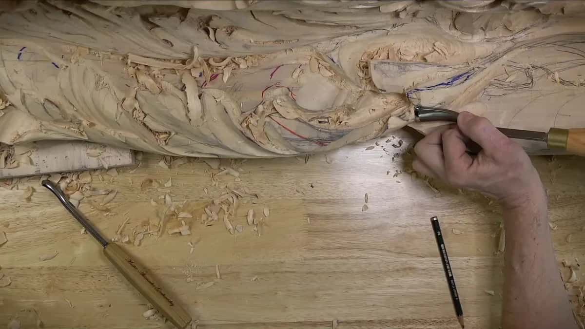 Back bent shank at the carving's edge, another bent tool and a pencil lying below