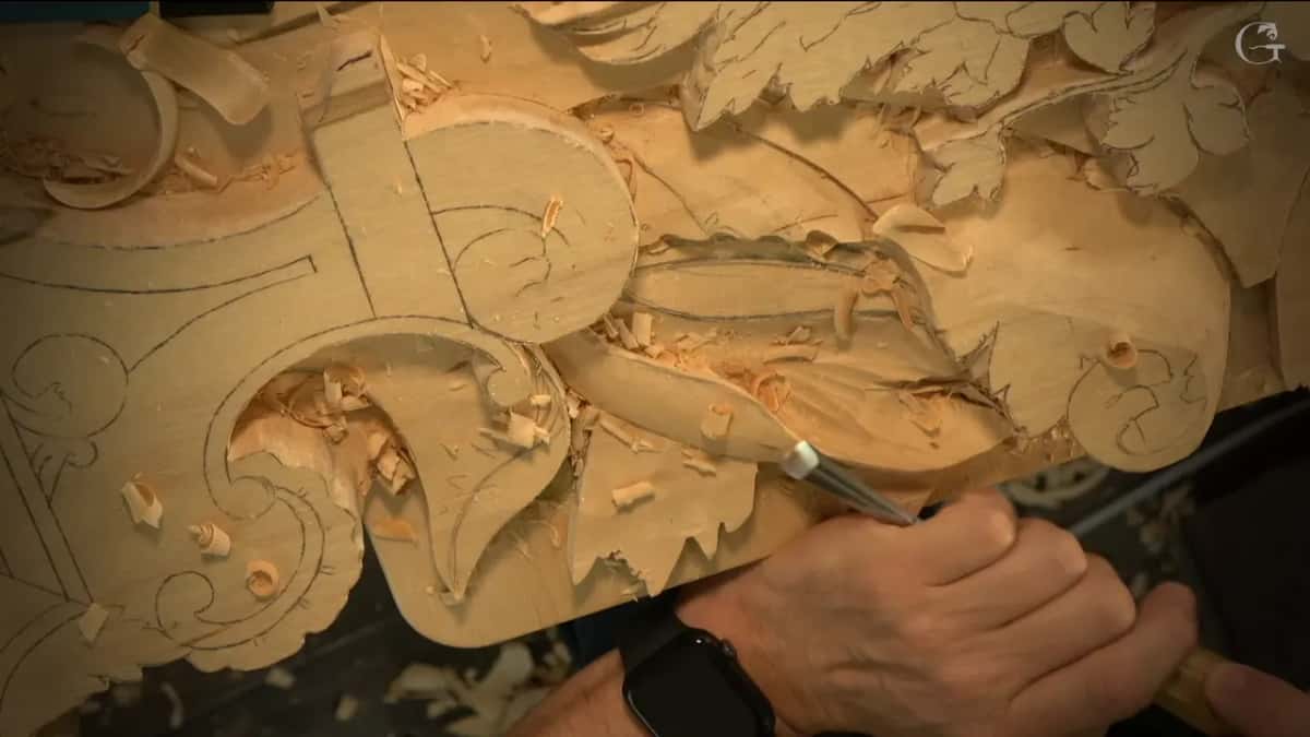 Gouge at work near the scroll.