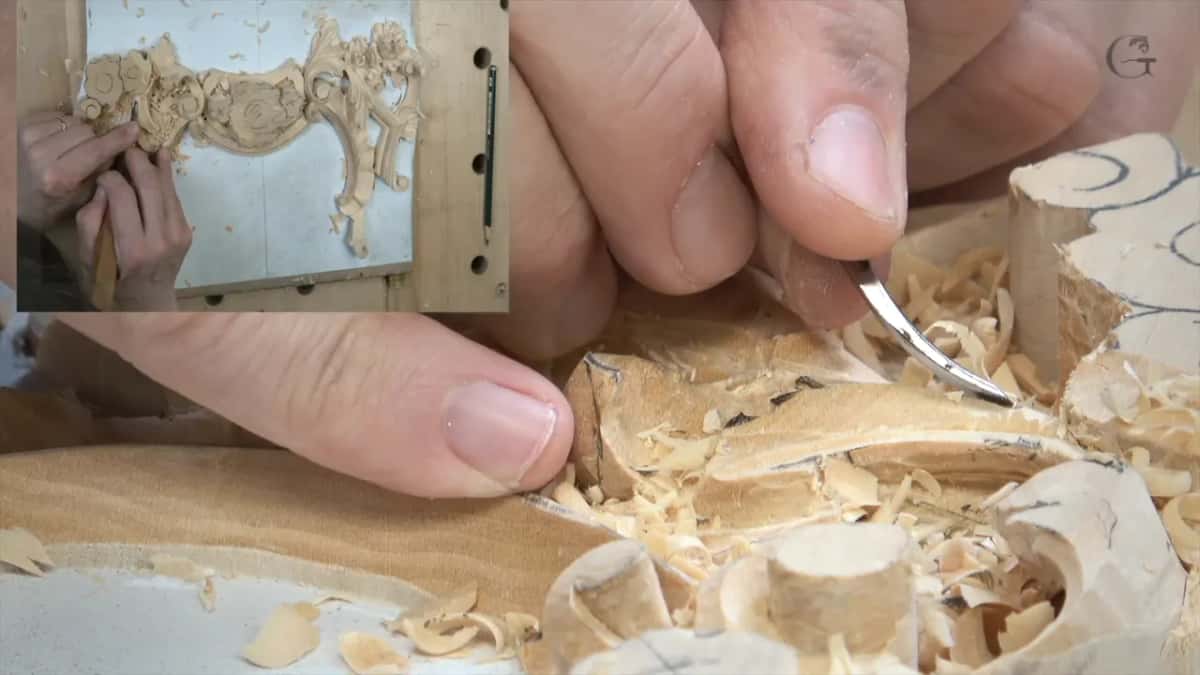 Fingertips guide a short curved blade