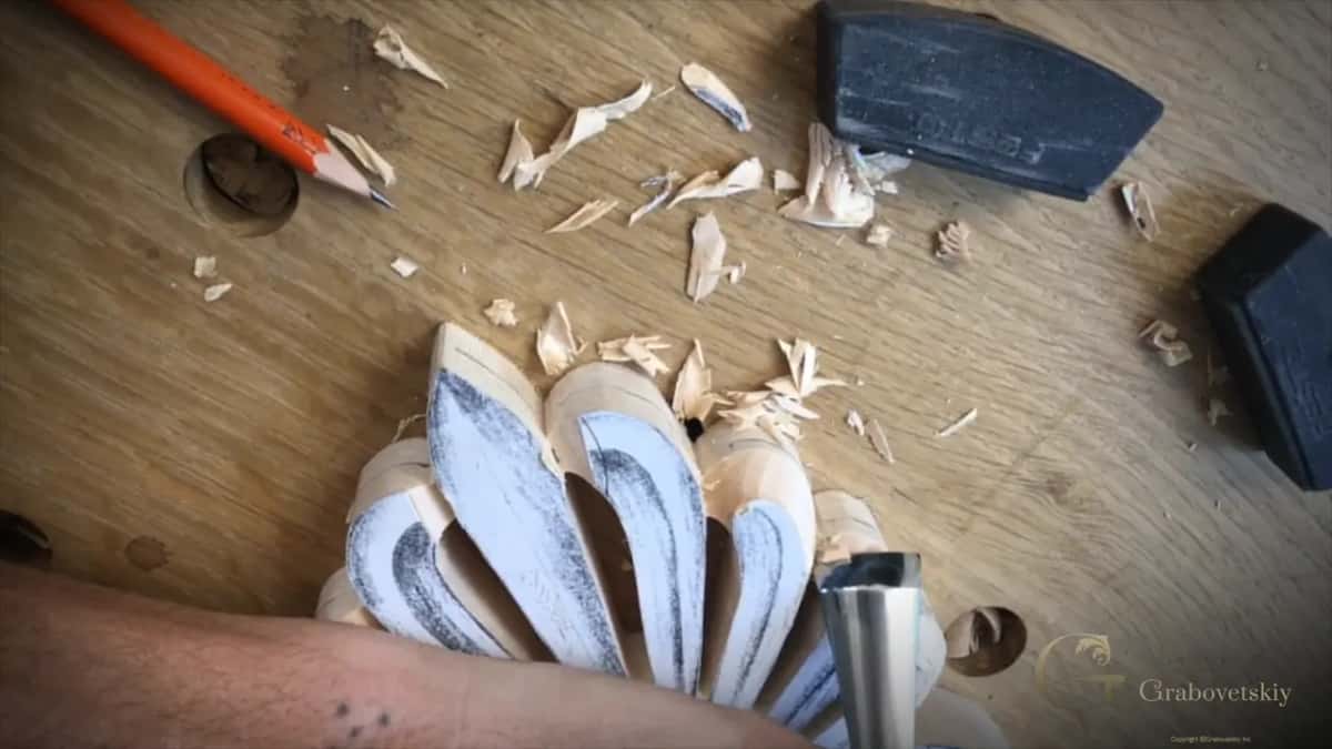 Roughed petal tips, chips scattered over the bench, a pencil and two stops up near the top of the picture