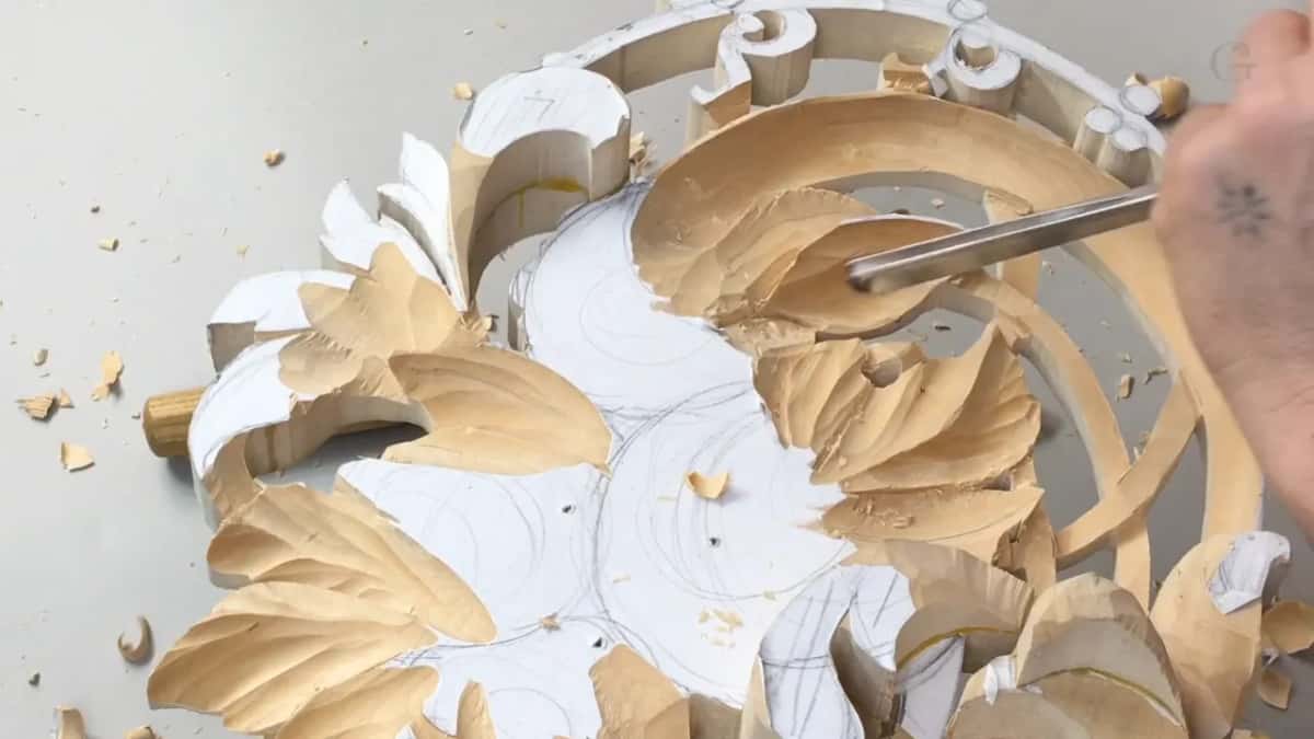Long straight blade laid into a leaf at the top, more veined leaves lower left and pencil circles on the paper