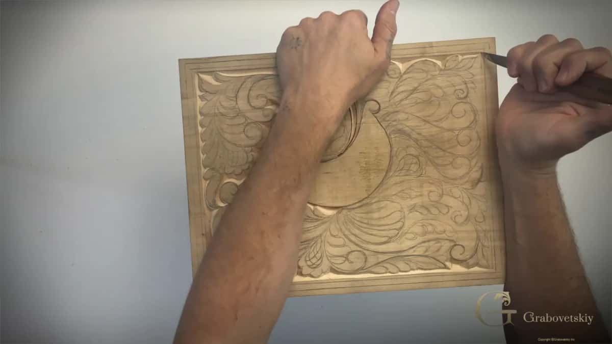 Fist on the board, blade at the top border