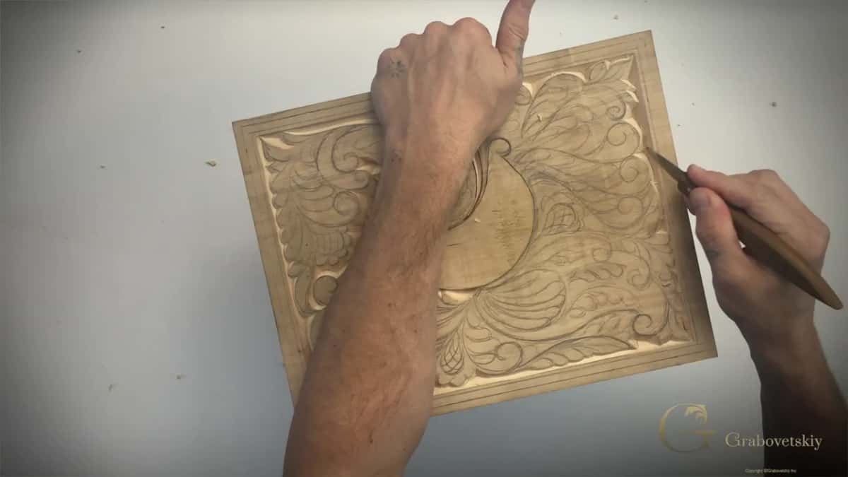 Board turned at a slant, left fist on top, knife at the right
