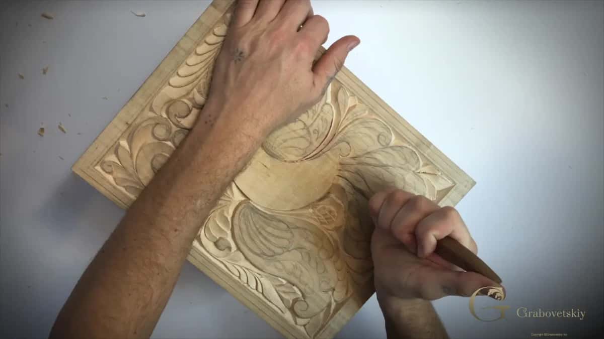Board set on a slant with my left arm across the top and the knife working at its right side