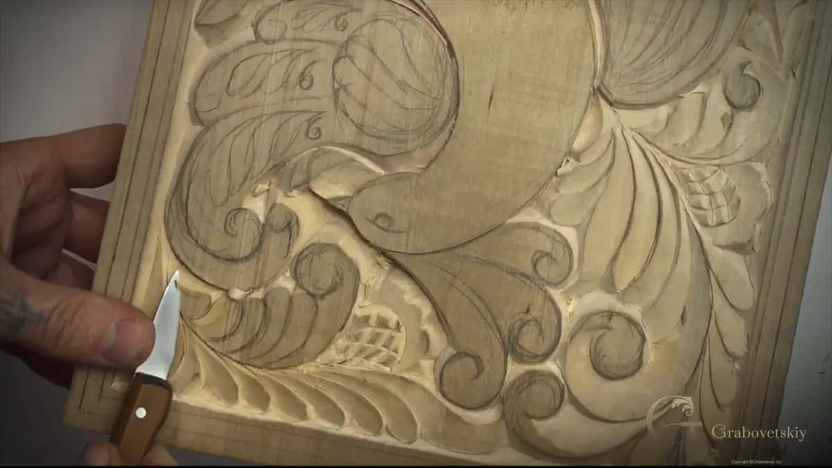 Knife held low on the left, pencil lines still showing on the plain bird
