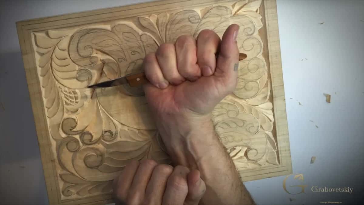Gripped from above in a closed fist