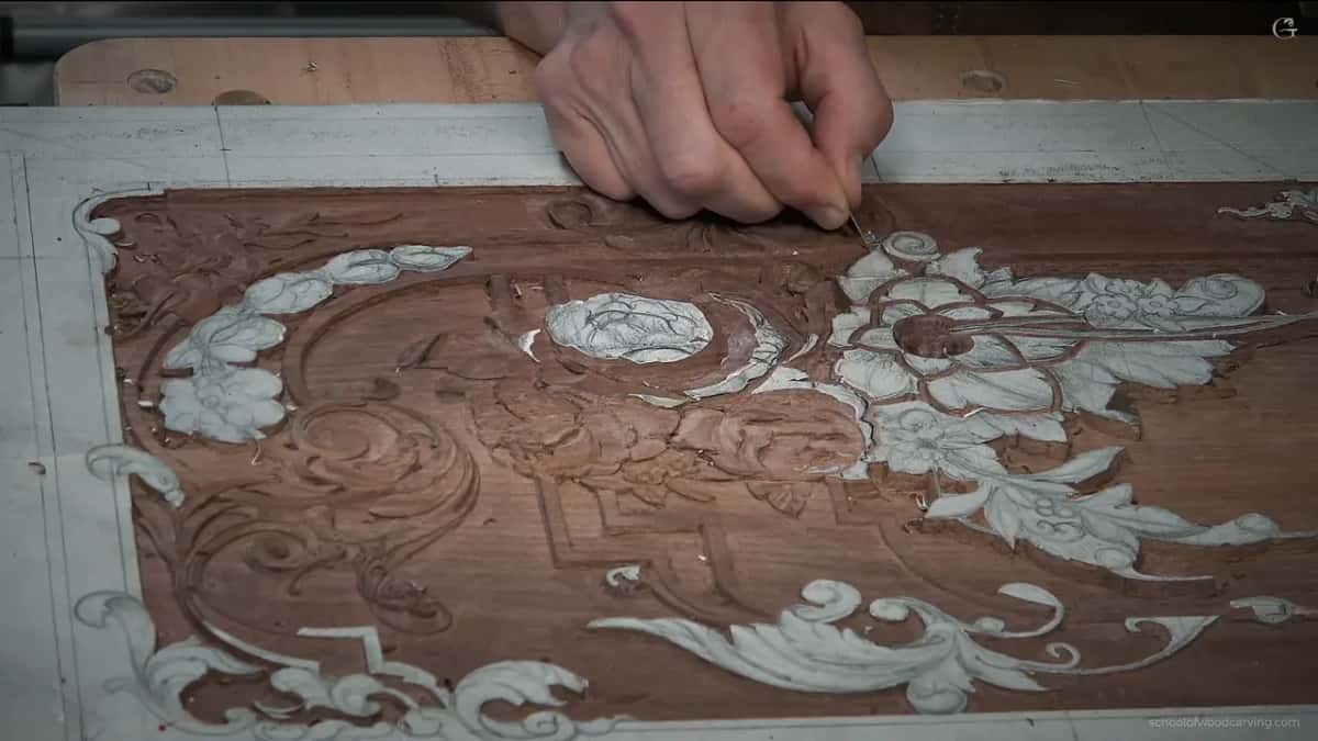 Whole panel at an angle from the front, one hand at the far edge and paper still on many leaves