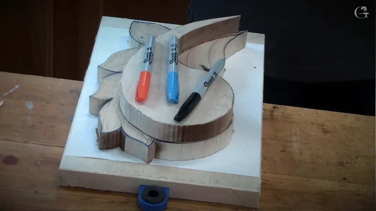 Three markers lying across the top of the sawn layers