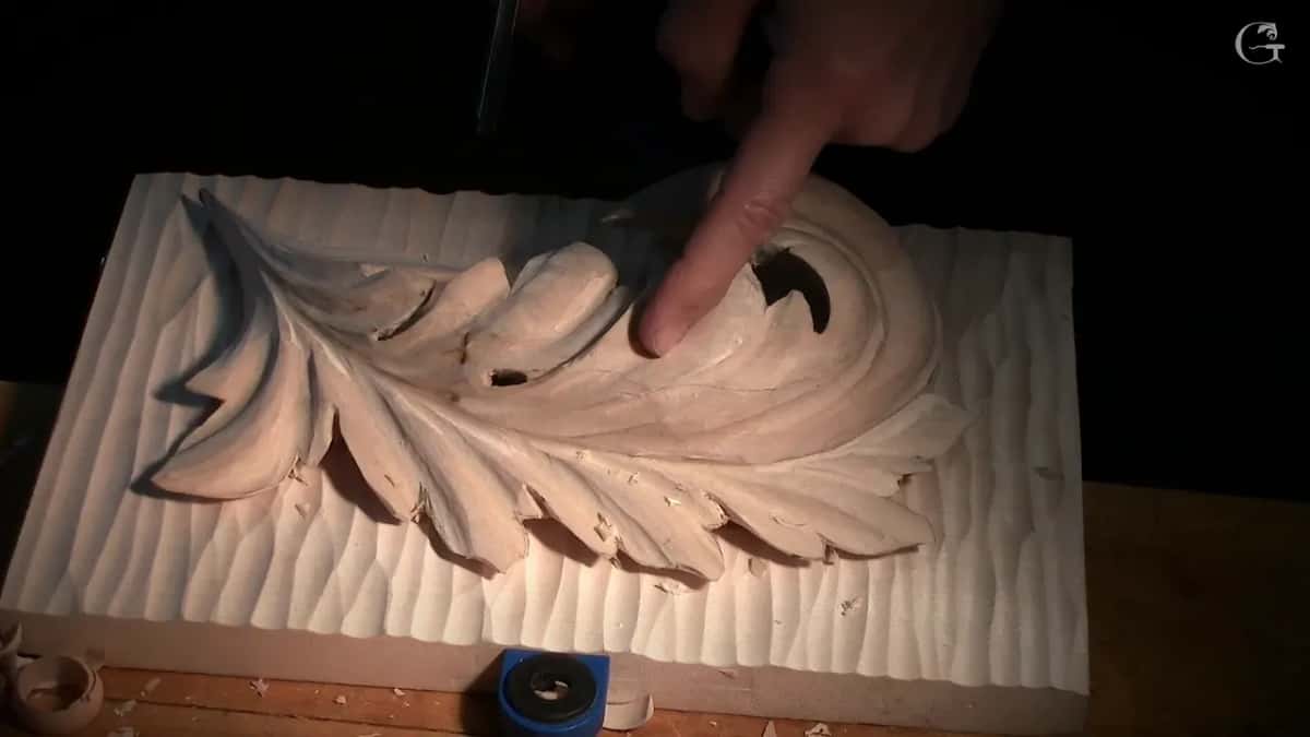 Finger in a hollow near the curl