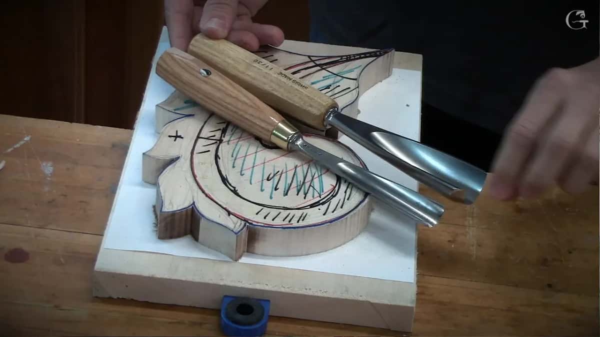 Wider of the two lifted clear while the other stays on the wood