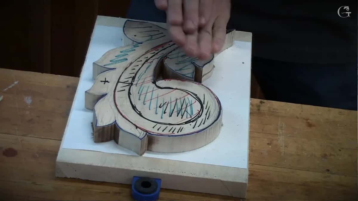 Drawn leaves of the blank under resting fingers, before any wood comes off