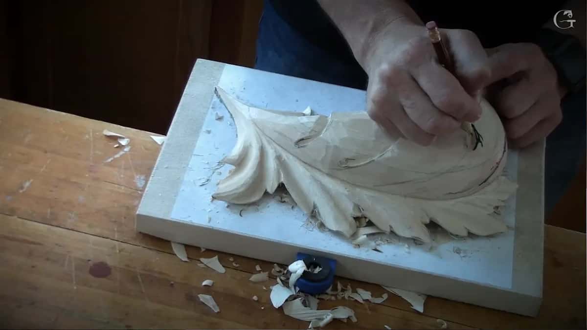 A pencil marks a line on the dome while a blue knob shows at the edge of the board below