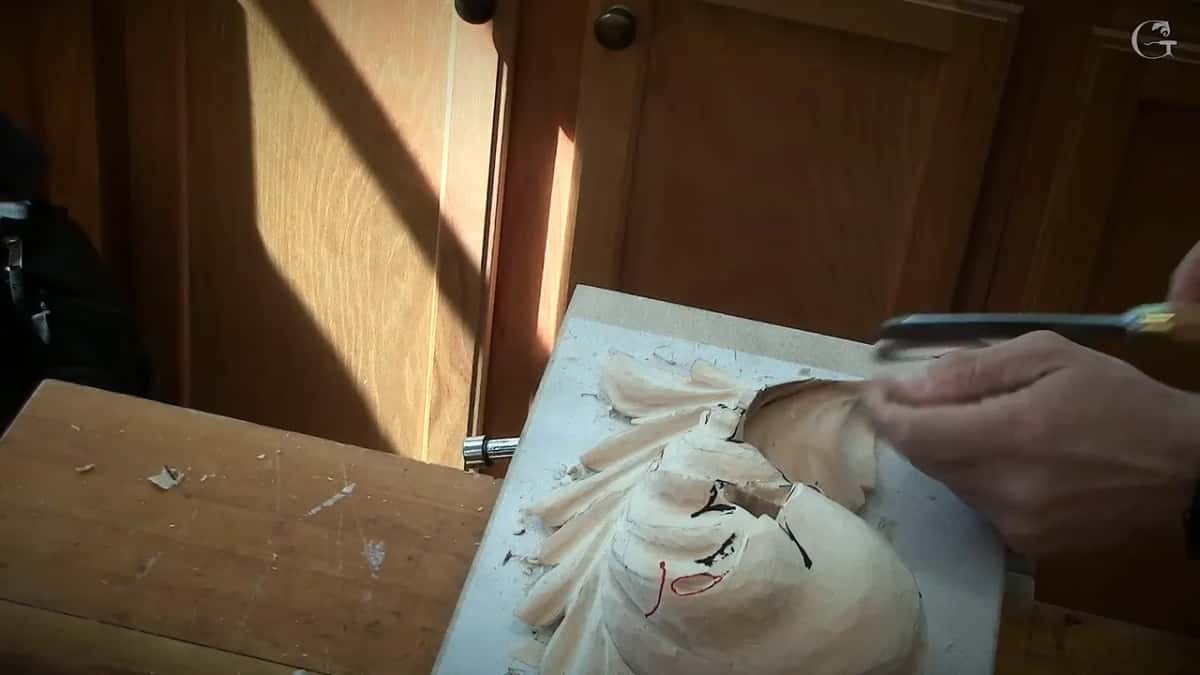 Seen from the other side of the bench, a gouge comes in level from the right