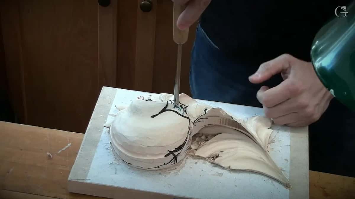 Gouge stood straight up on the dome, one hand at the top of its handle