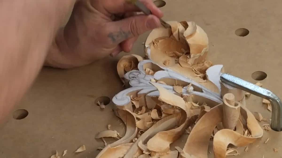 A tattoo on the hand that holds the tool in the curled top