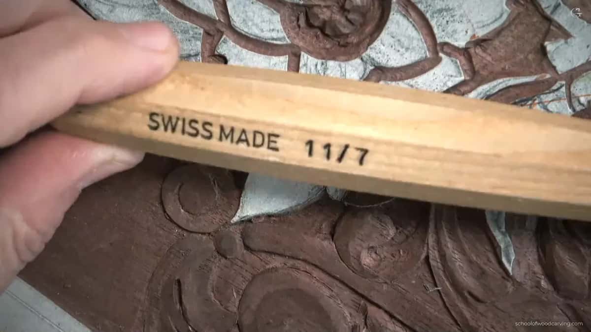 The handle turned toward the camera so the stamp reading Swiss Made and eleven seven is legible.