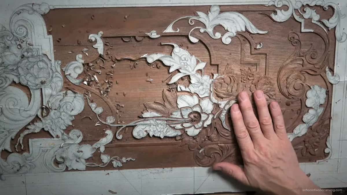 Overhead, his hand flat on the panel