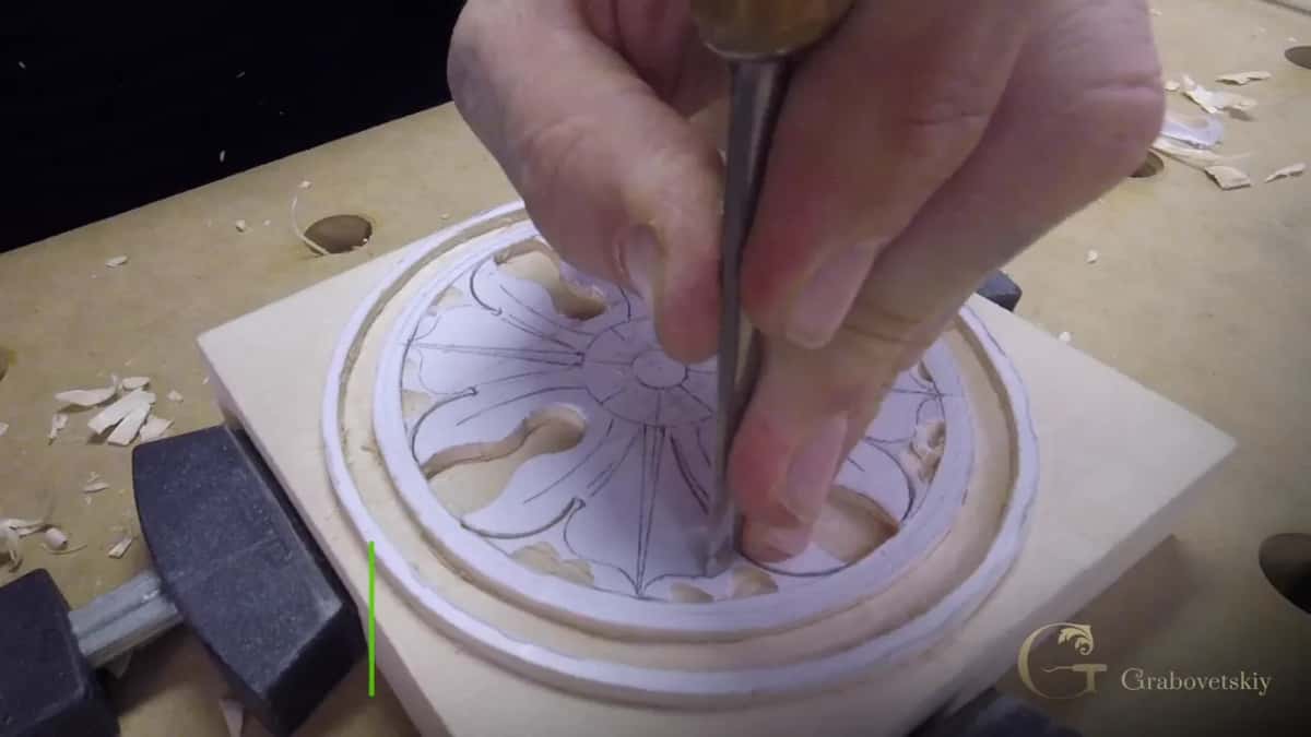 Both hands guide one tool straight down.