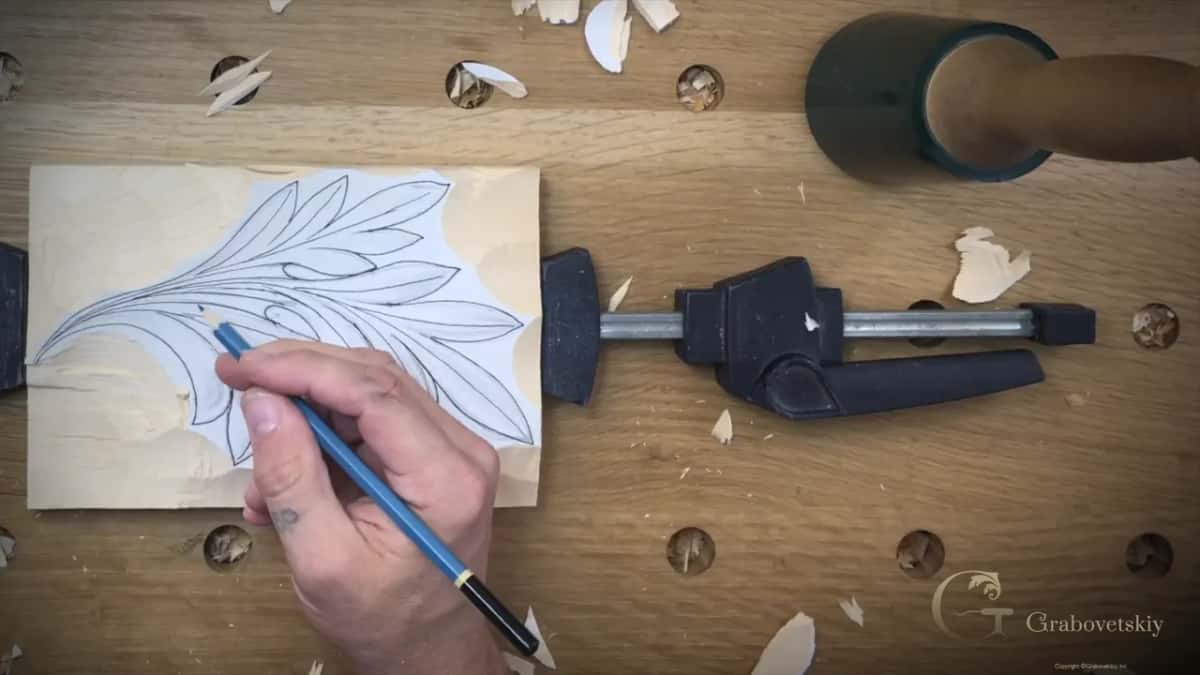 Pencil touching up a line on the paper after the ground around it has gone down