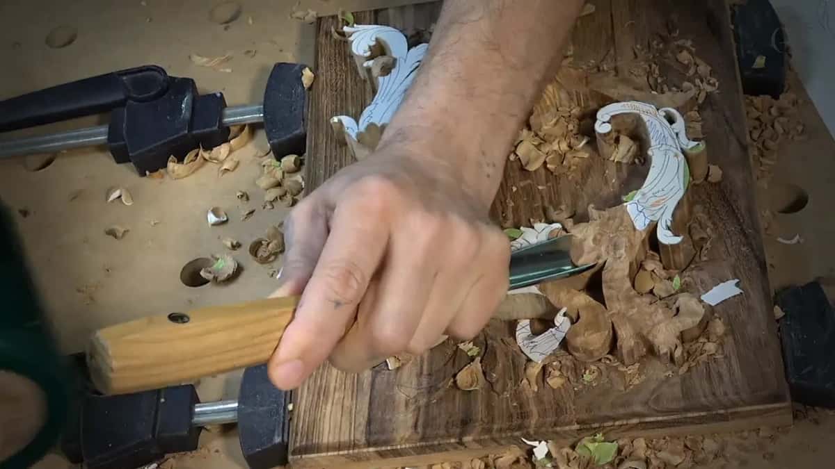 My fist around a pale handle, pushing the blade in from the left
