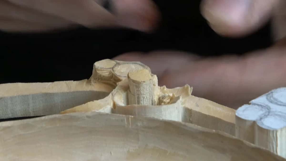 Low view along the frame, the rounded curl standing up between flat walls