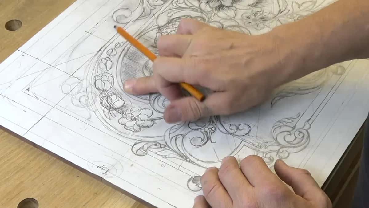 Hatched shading inside an arch under an orange pencil