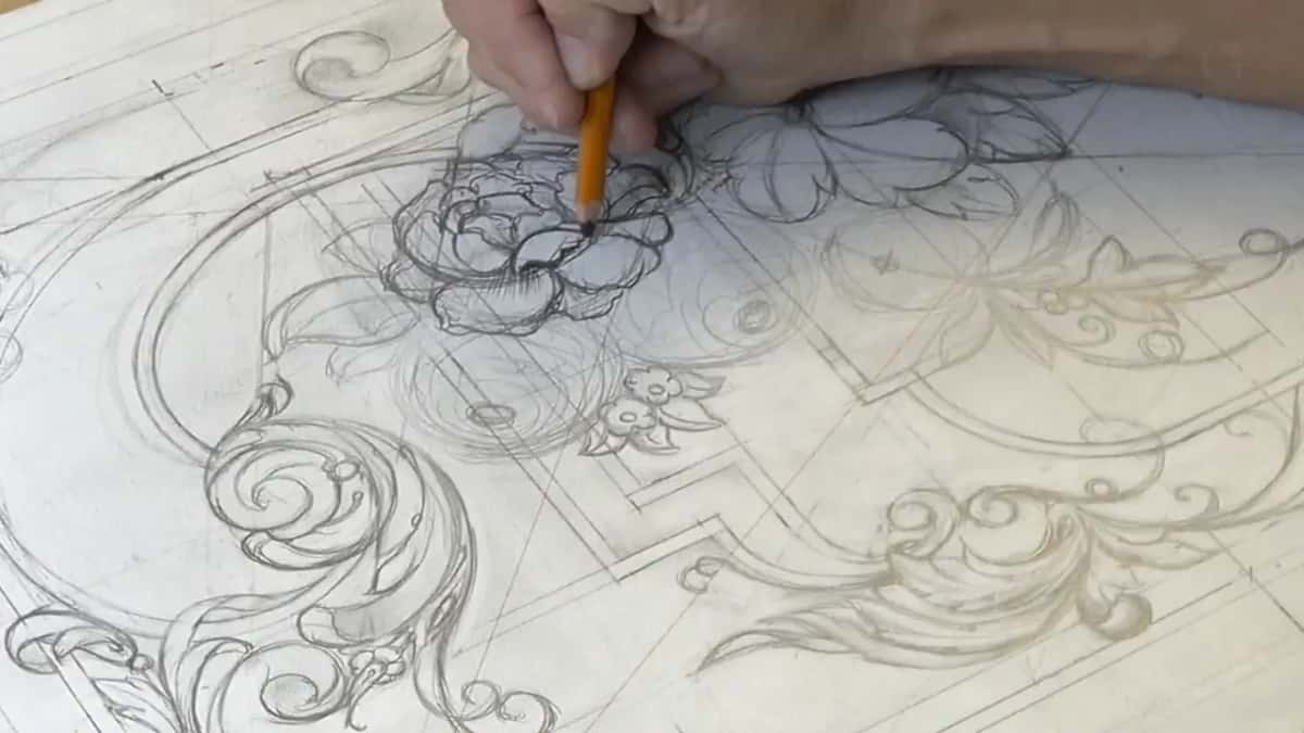 Orange pencil darkening a layered flower