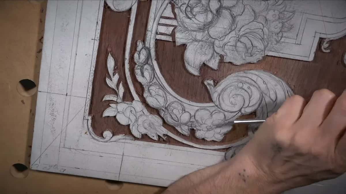 Small tool at the edge where brown ground meets white paper