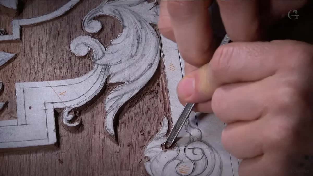 Close view of a narrow tool down in a curl of the scroll