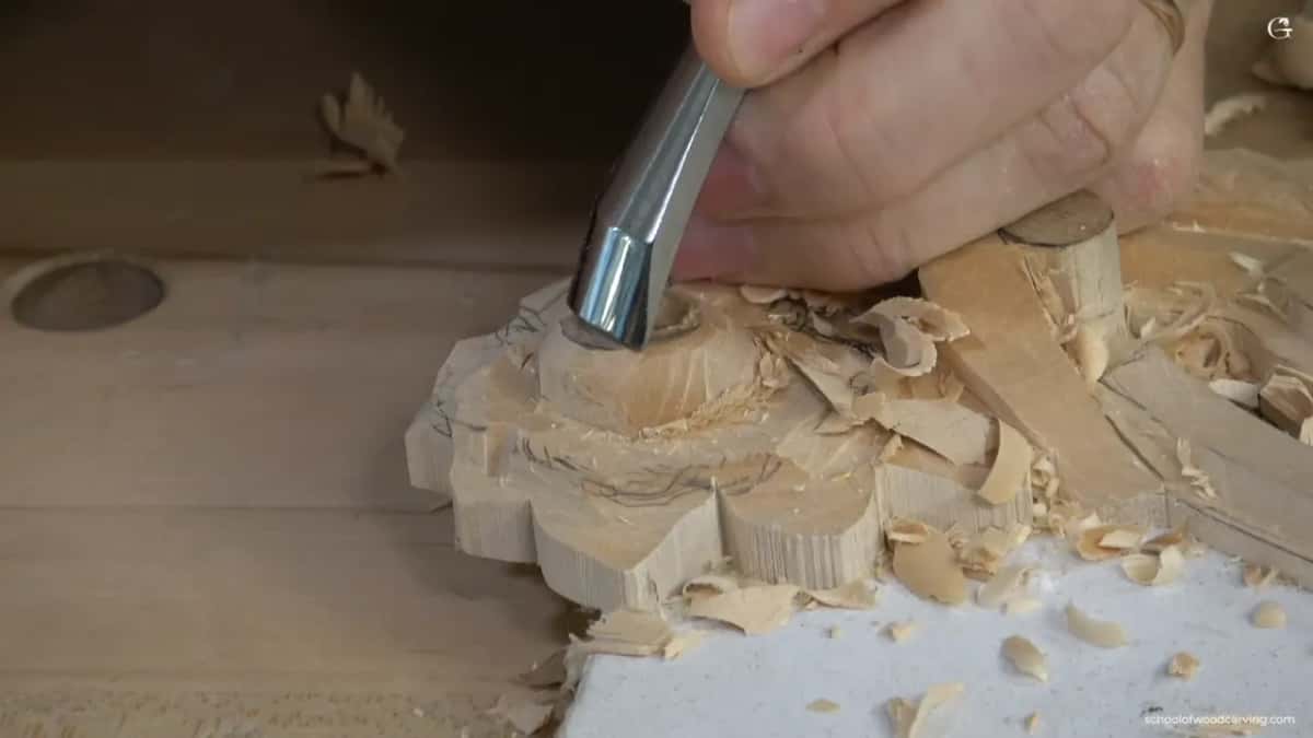 Bevel down on the raised middle, shaving it toward a ball instead of scooping into it.