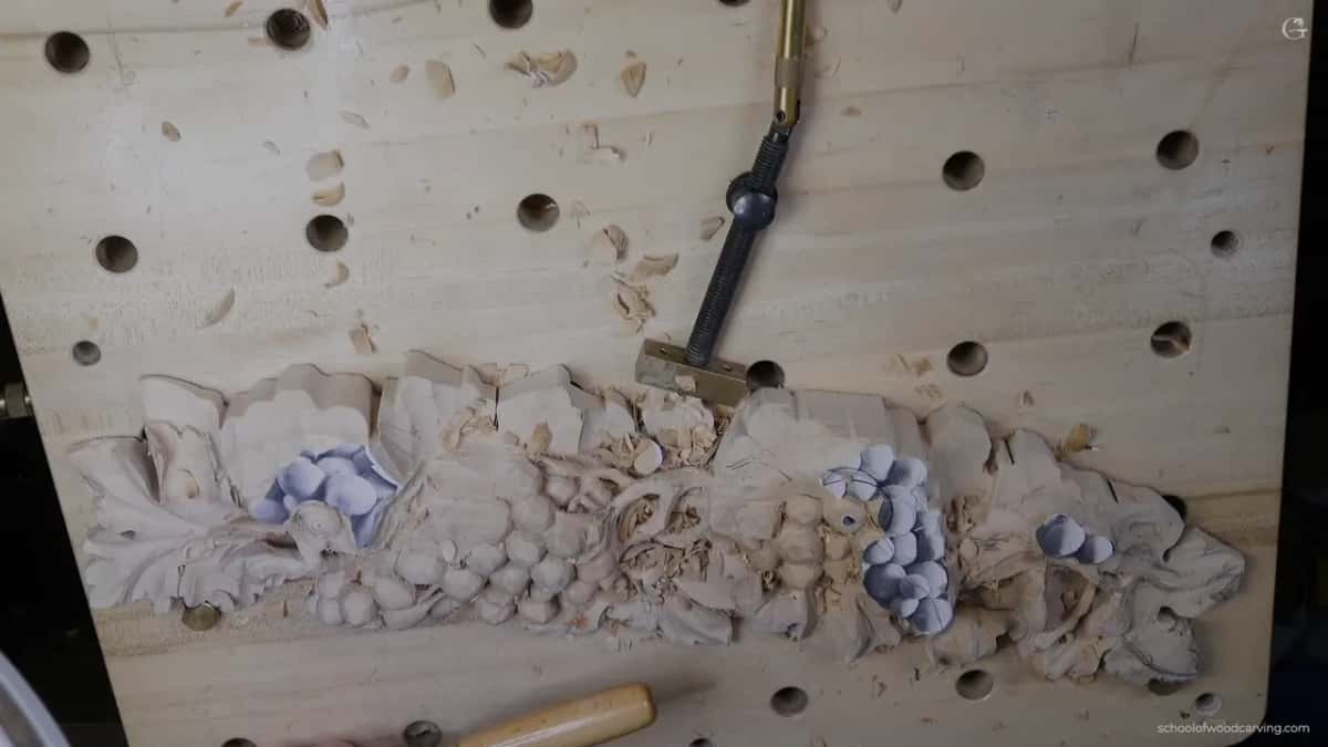 Chips scattered on the bench around the panel and its holdfast