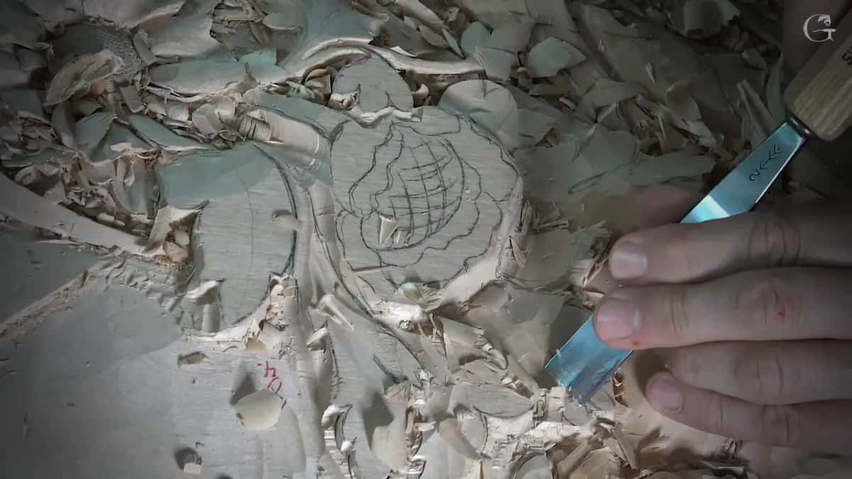 Stamped flat shank held against a leaf