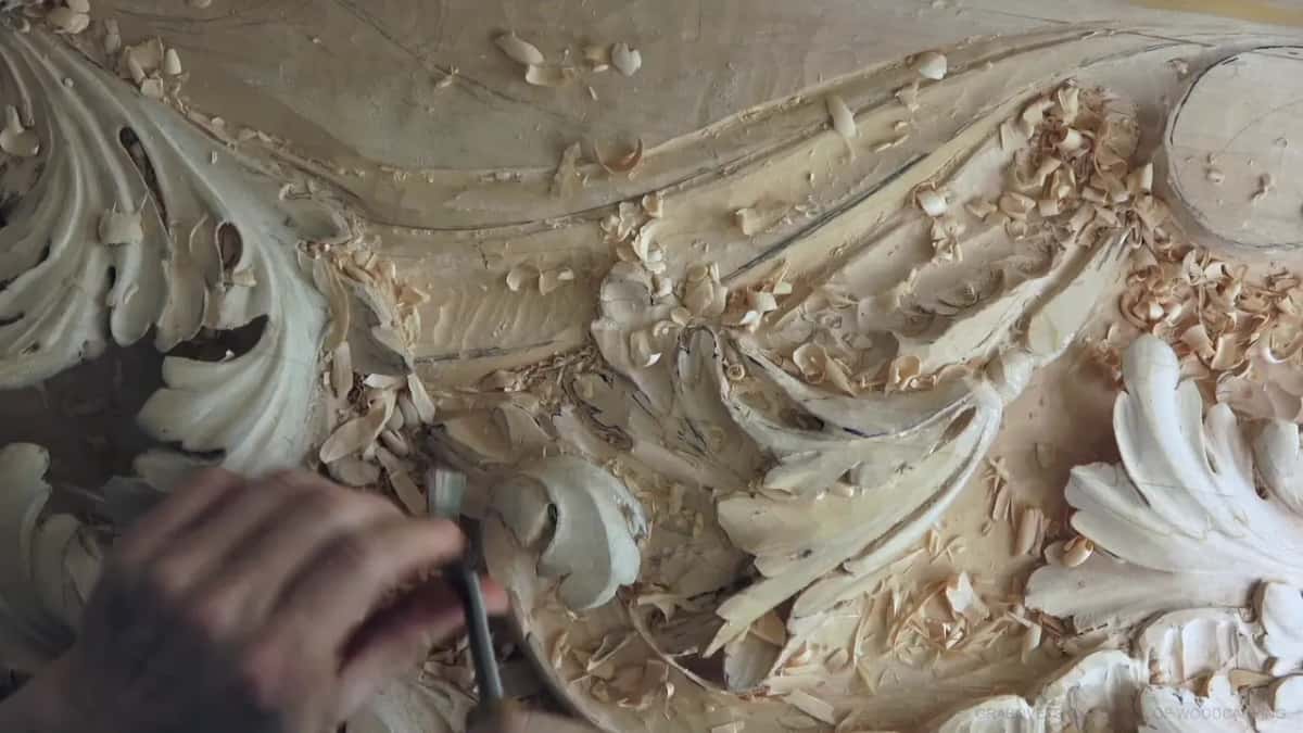 The hollow, about half dug, with a hand and gouge at the lower left.