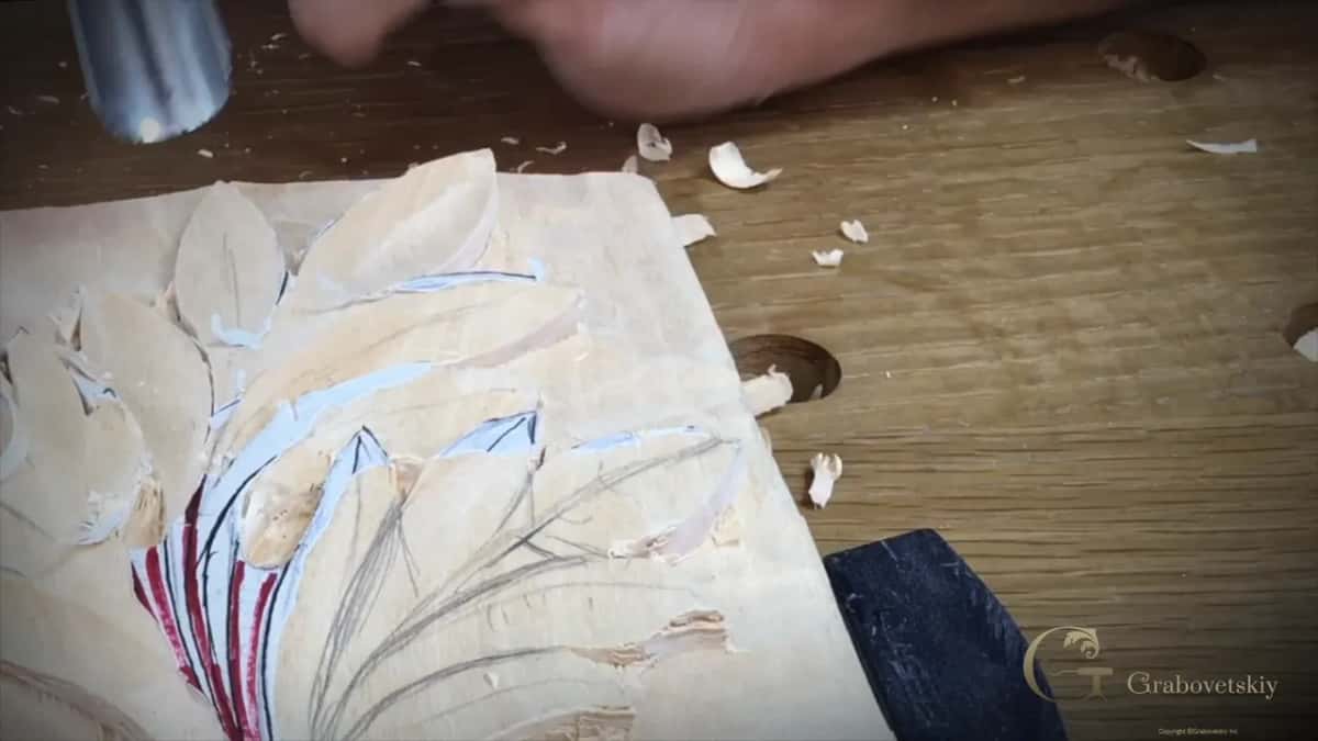 A big gouge waits at the top left while fresh pencil lines cover the lobes