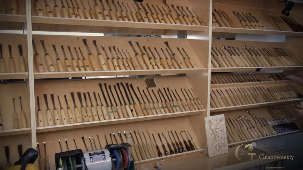Wall shelves full of carving tools