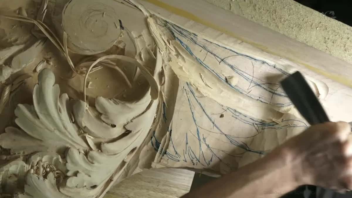 Dark handle over blue marker lines near a spiral.