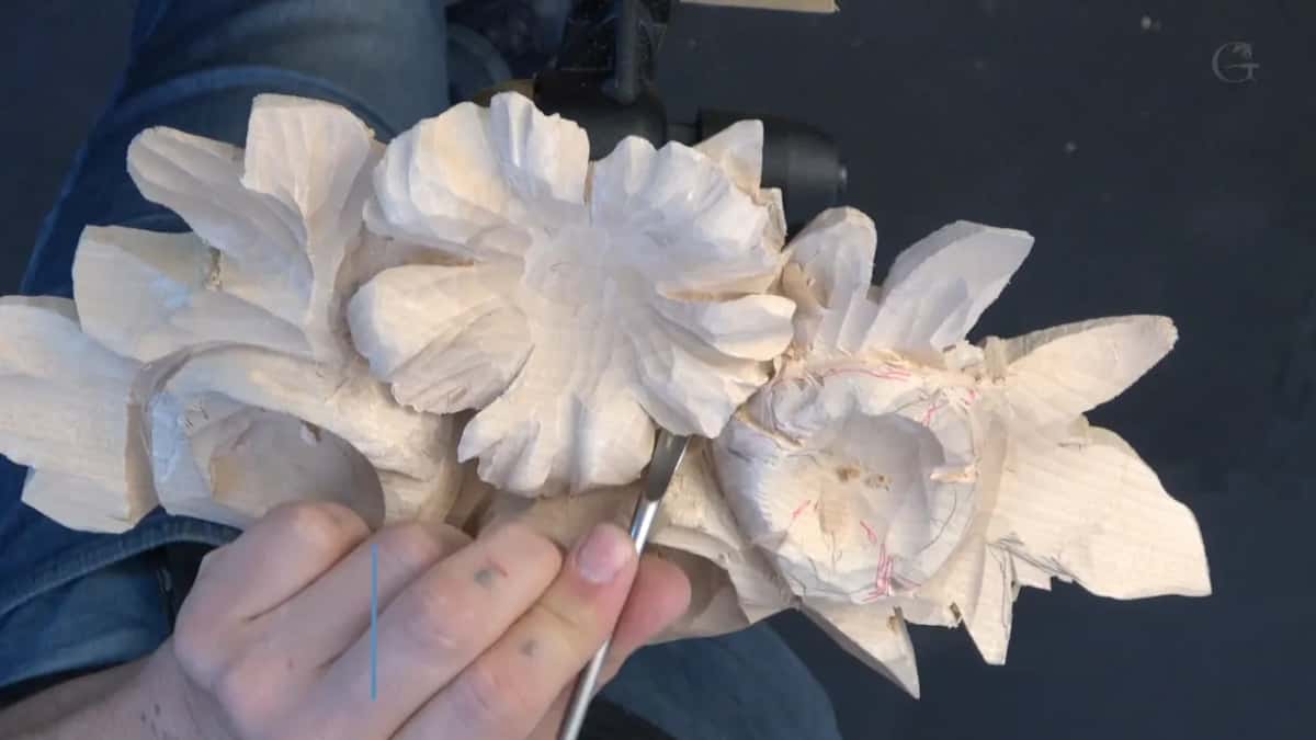 Thin blade going into the red-lined flower at right