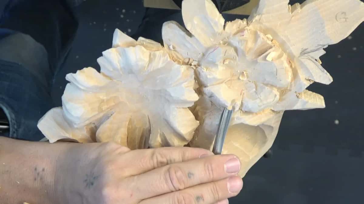 Straight gouge stood upright against a flower