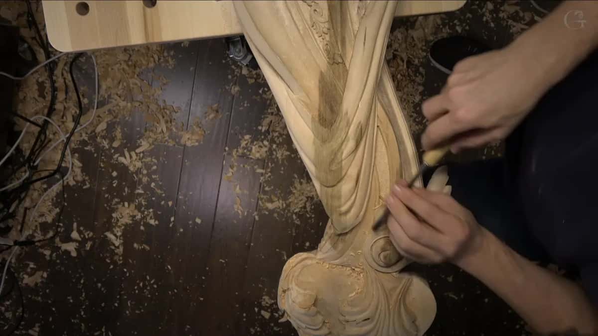 Thin gouge entering the drape from the right.