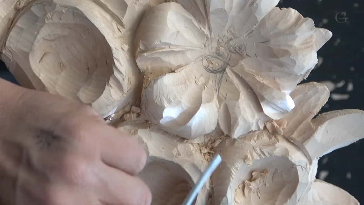 Round steel shank going in under a petal, pencil marks on the centre above