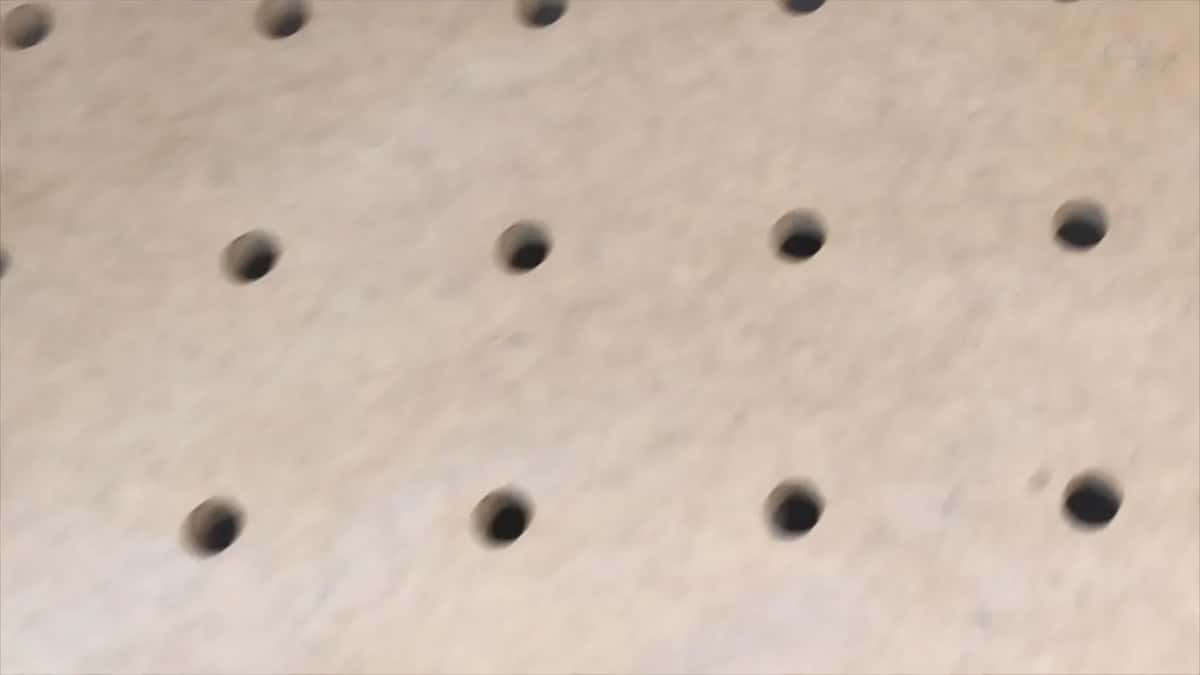 Close view of the MDF bench and its rows of clamping holes
