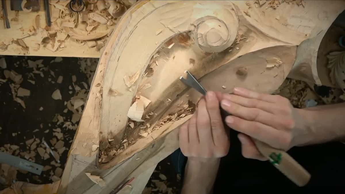Shaving inside the hollow with a gouge whose handle carries a green mark