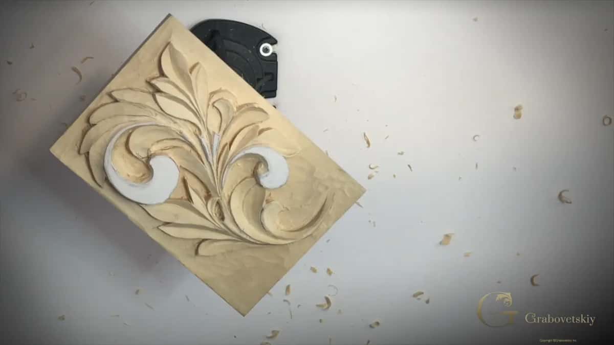Whole panel on its holder with chips scattered across the table around it