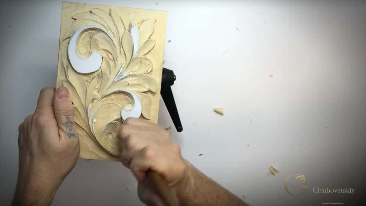 Upright panel with a fist on a tool handle, bottom right