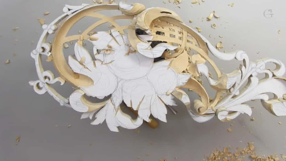 The whole panel alone on a grey bench, with chips scattered around it