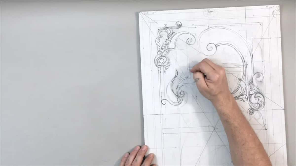 Hand pressed to the left side of the drawing, the other at the bottom edge
