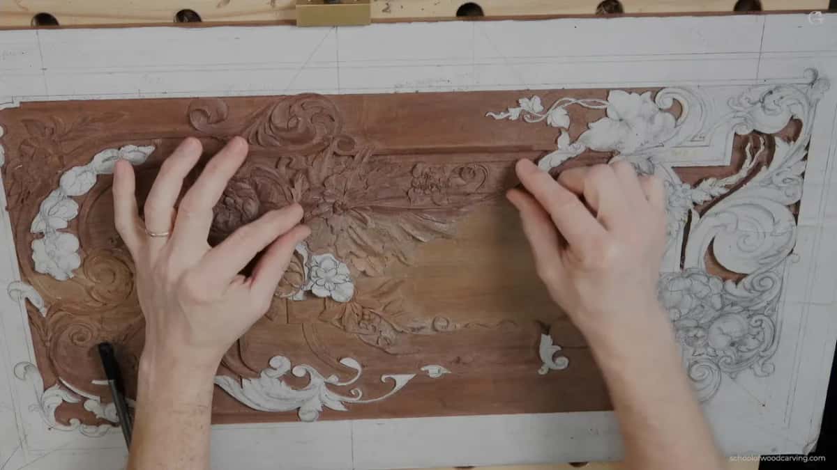 Two hands spread over the flower cluster, one on each side