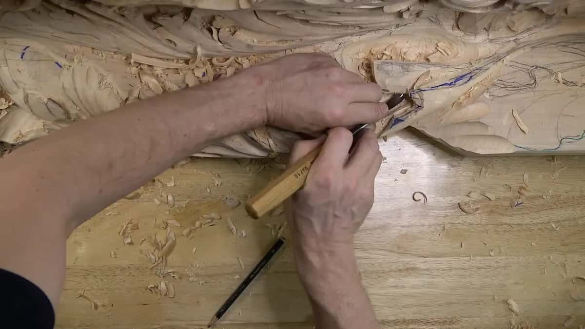 Lettering on a pale handle as the blade goes into a lower lobe