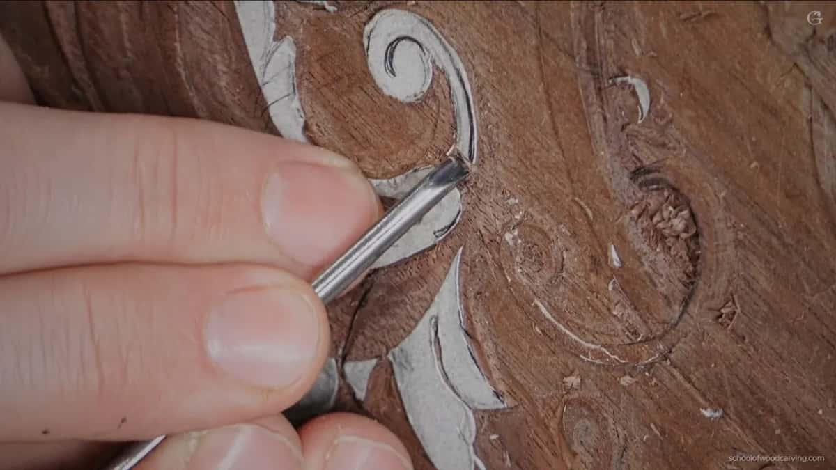 Small gouge pinched at the edge of a paper leaf